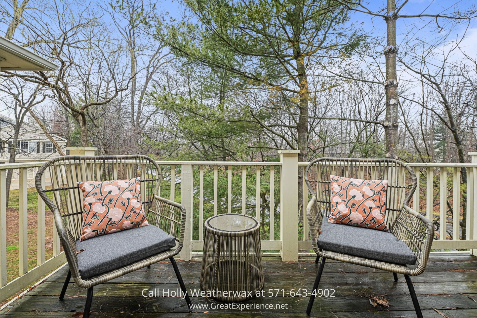 2BR Condo in Reston VA a couple of chairs sitting on top of a wooden deck