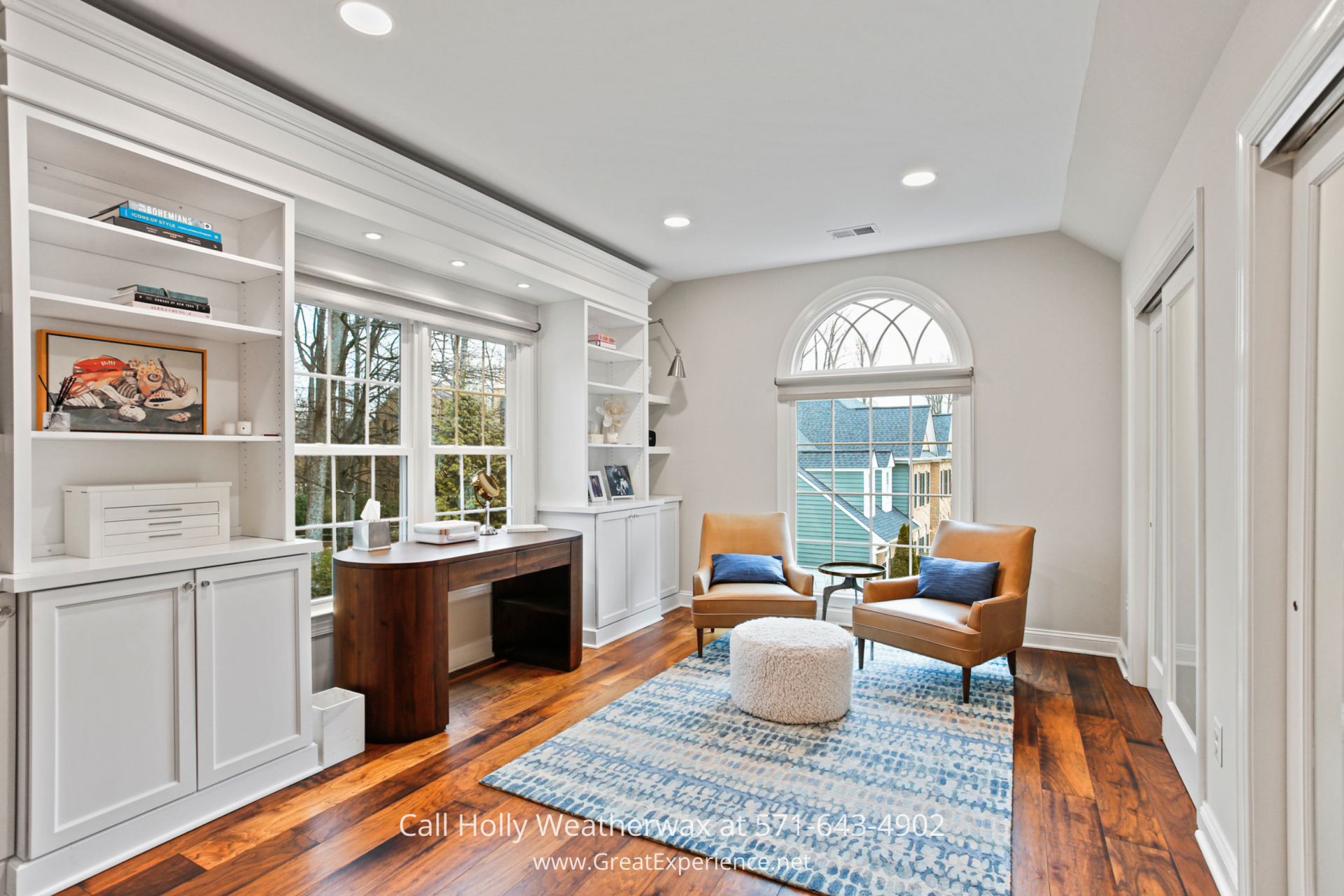 Private sitting area at 1110 Round Pebble Lane, Reston, VA, with built-in shelving, large windows, and hardwood floors.