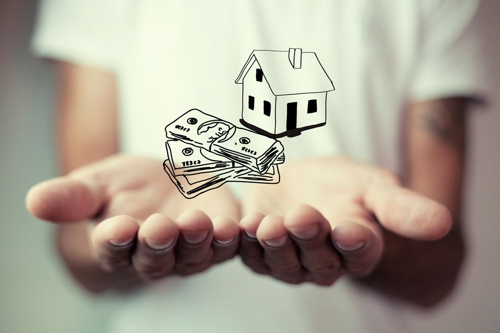 An Illustrated Image Of Money and Home On A Person's Hand