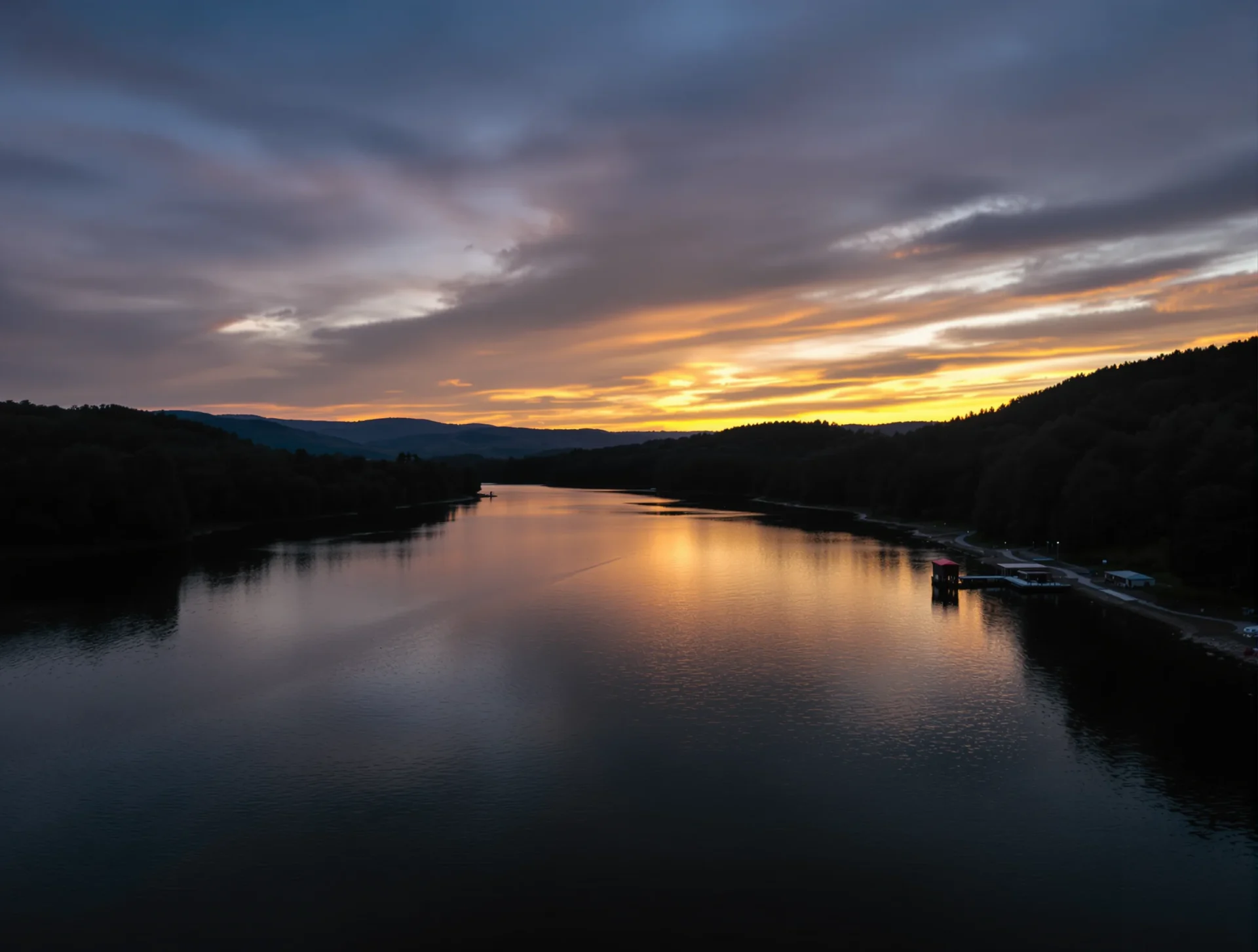 River and wooded hills near Cleveland, Tennessee at sunset