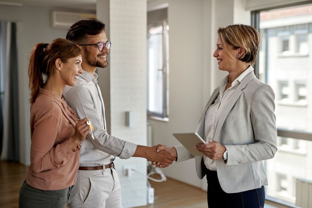 Realtor-shaking-hands-with-the-home-seller Realtor shaking hands with the home seller