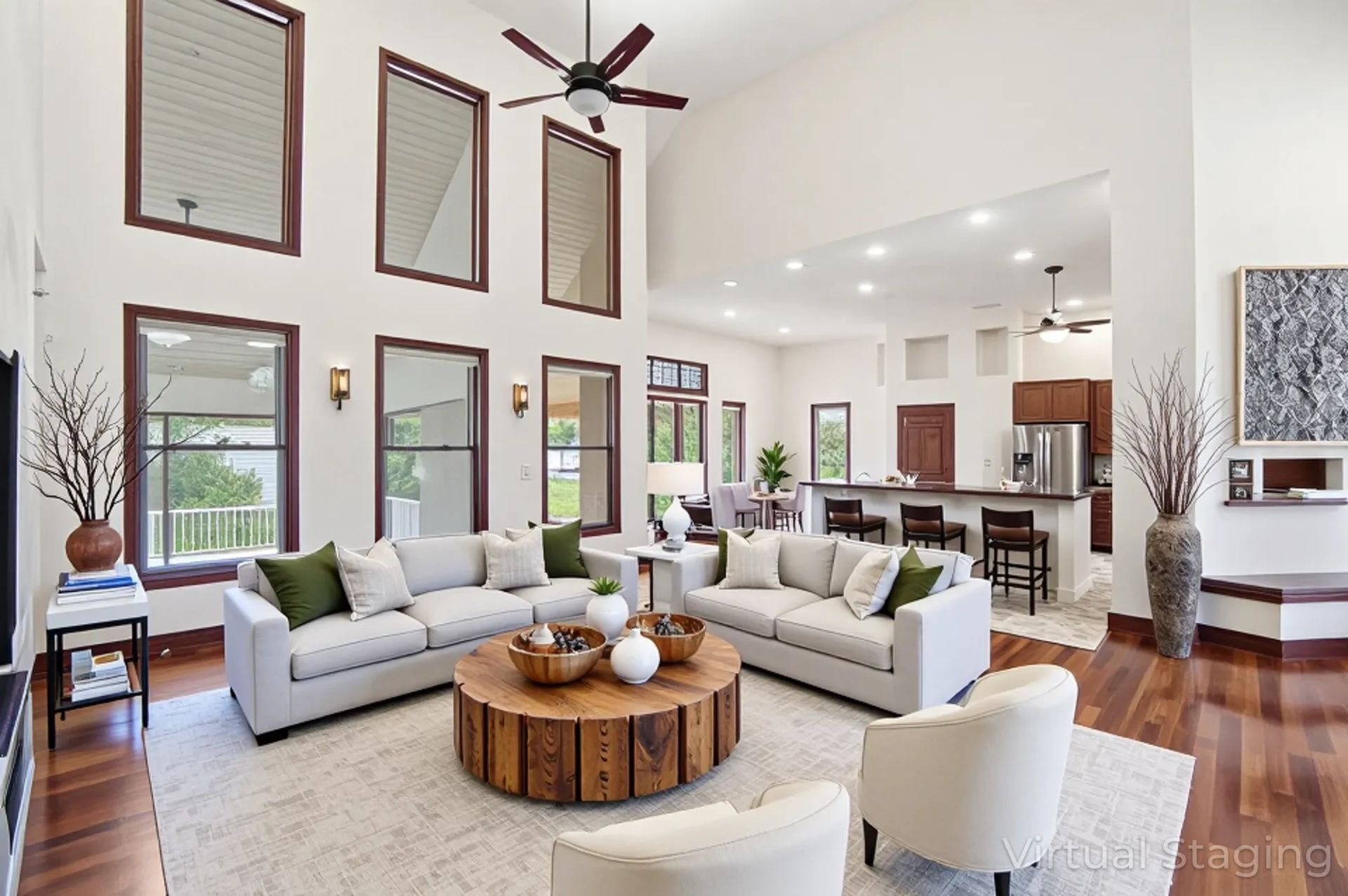 Great room with vaulted ceilings, Brazilian cherry hardwood floors and abundant natural light in Green Pastures custom home