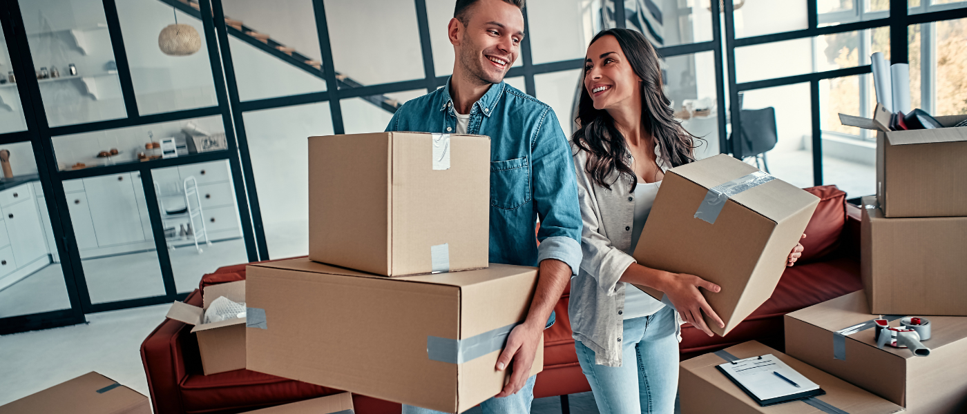 young couple with moving boxes