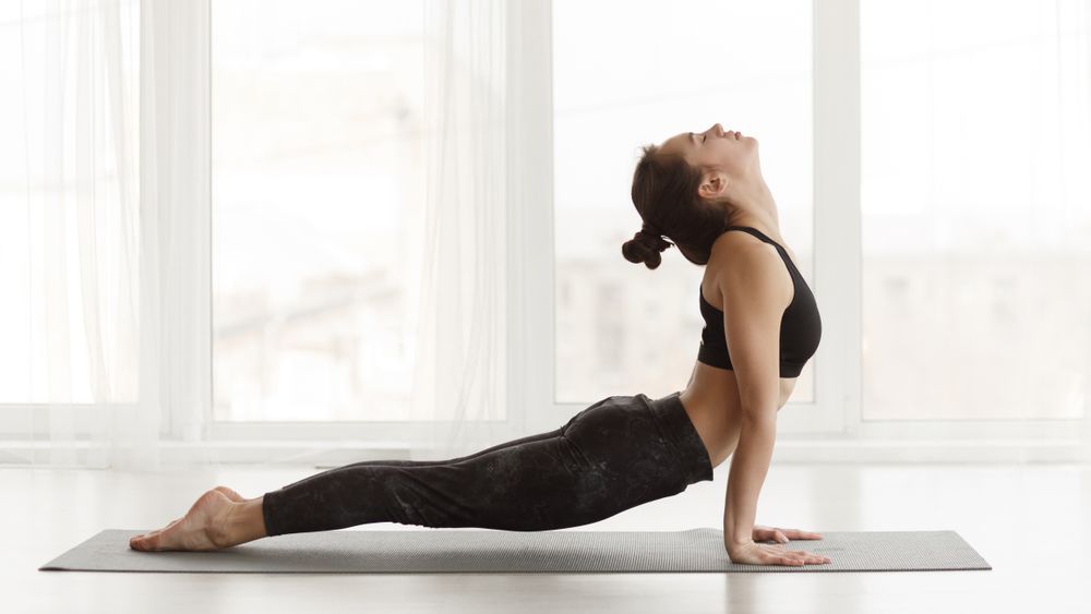 A woman doing yoga stretches