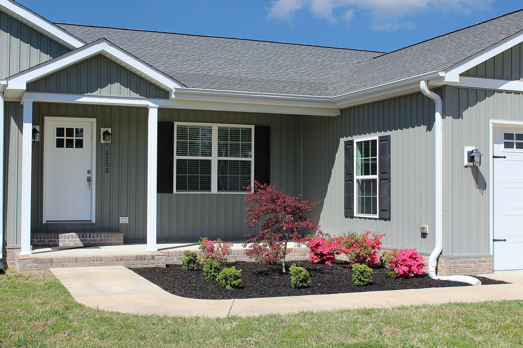 Front porch entrance and beautiful landscaping