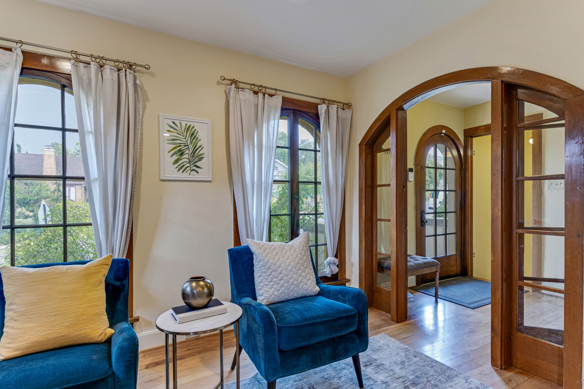 should i stage my home a beautiful living room with interior windows and blue velvet furniture