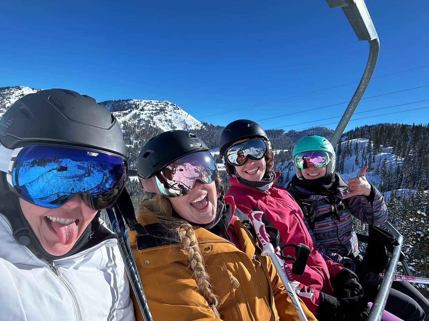 ski utah a group of women on a ski lift look happy to be there