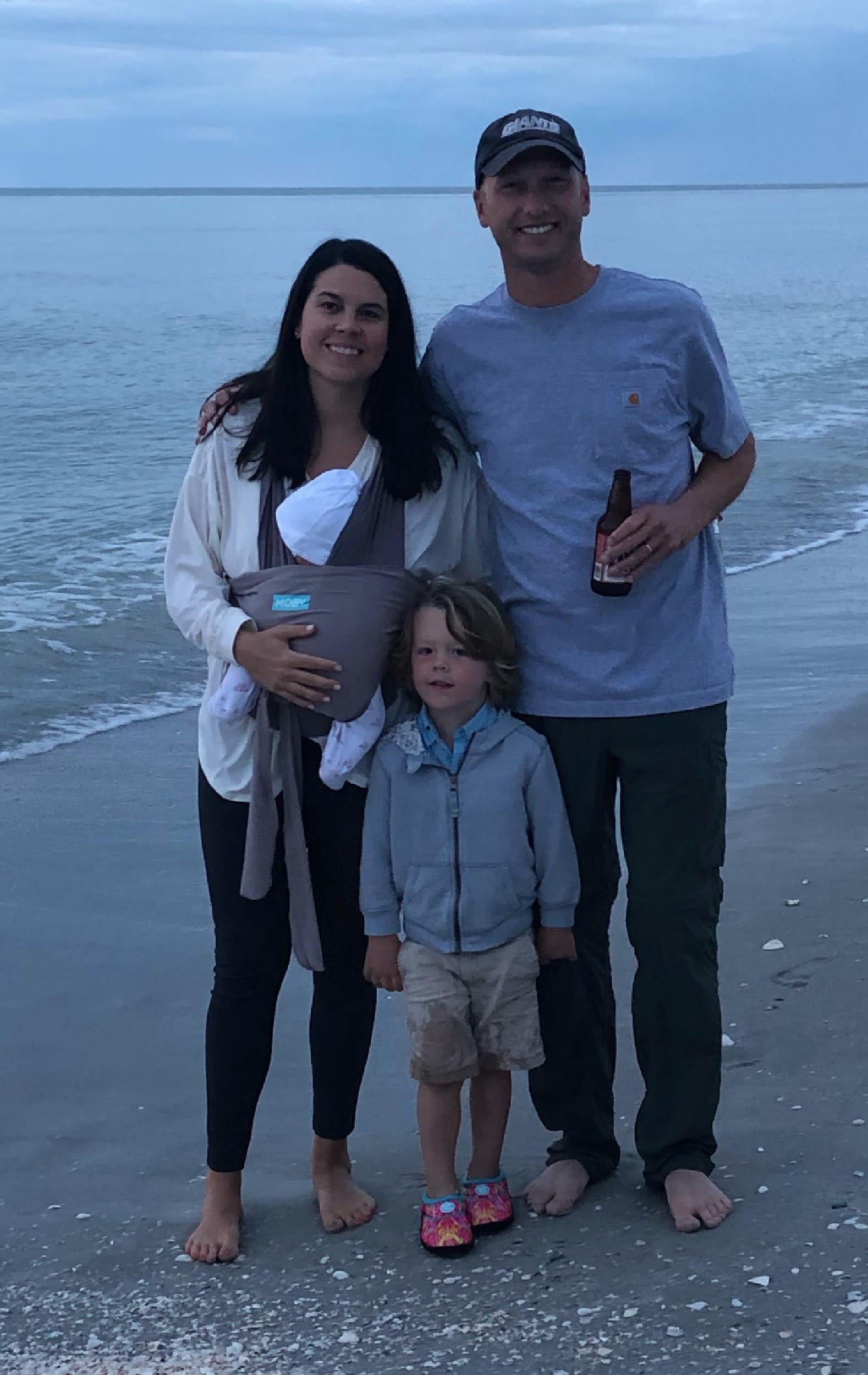 Firefly Realty Agent Michaela Schmidlin with her husband Matt, son William and daughter Anna, on a beach on Sanibel Island in Florida. 