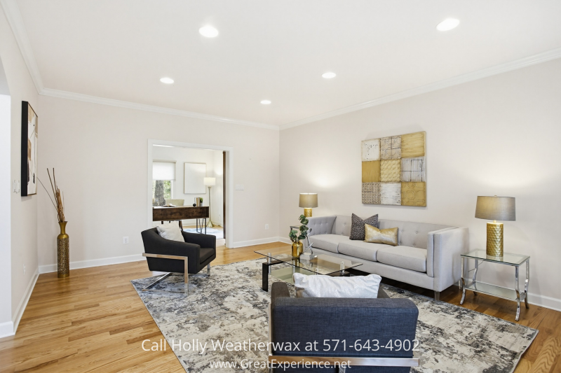 Bright living room at 11316 Bright Pond Lane, Reston, VA, featuring hardwood floors, modern seating, and an open, light-filled layout.