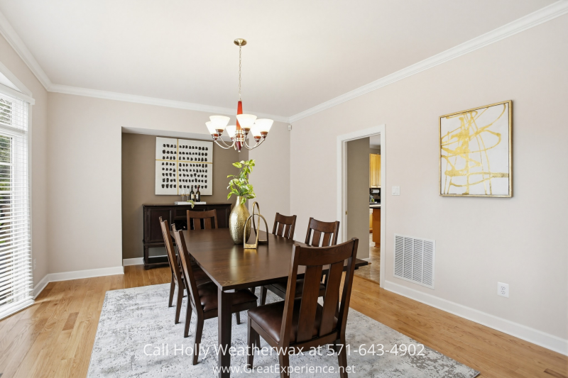 Elegant dining room at 11316 Bright Pond Lane, Reston, VA featuring hardwood floors, large windows, and a spacious layout ideal for gatherings and entertaining.