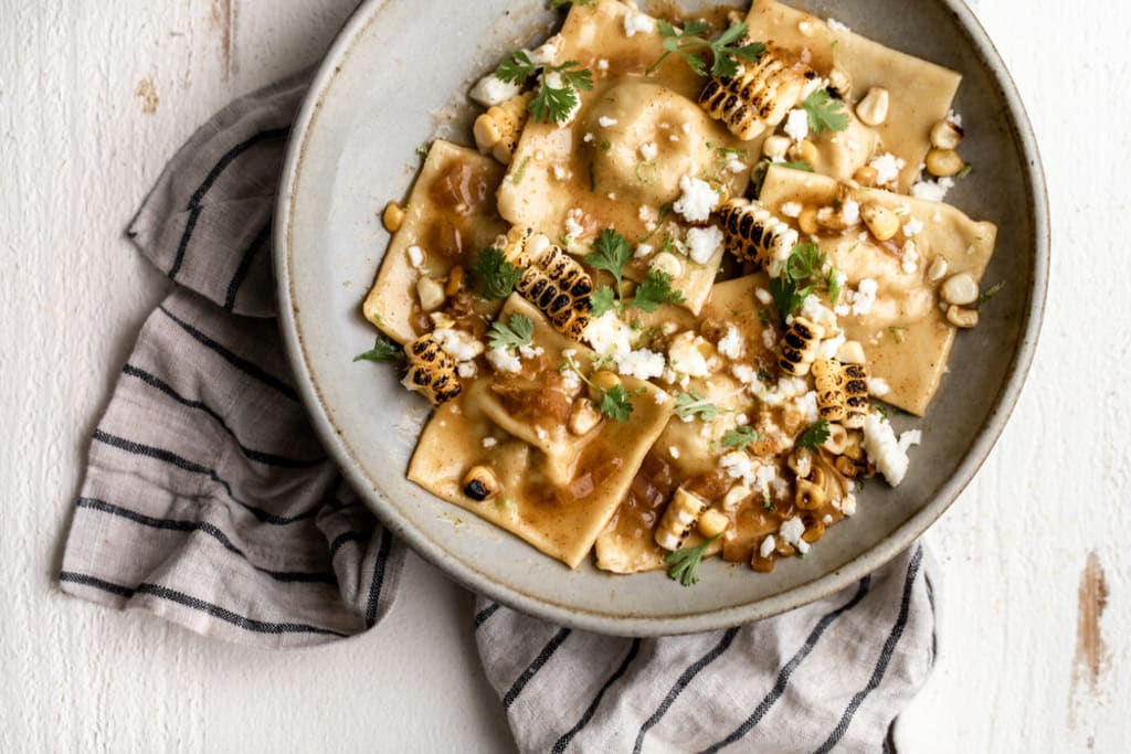 ELOTE-STYLE SWEET CORN RAVIOLI IN CHILI BUTTER SAUCE inception-app-prod/ZGU4NzRiMTUtMTFjOC00MjBjLTg4ZDEtNjllMTllZTZmZmE2/content/2024/08/dfd0f05cf926bd26feecf7720a2b940f302c651a.jpg