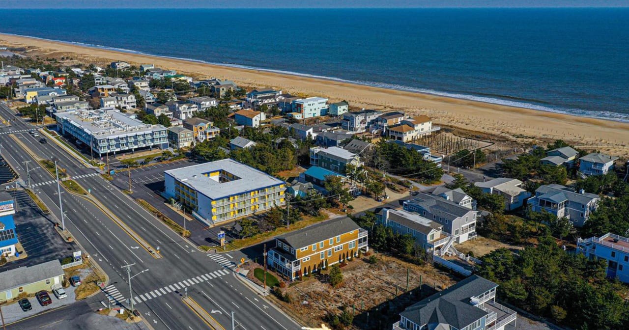 DE & MD Beach Homes & Condos inception-app-prod/NTBmZTc1MmItNWRkZi00MWQzLThkMWMtMWYwNzc2YjIzODhi/content/2021/06/CoastalDEMDBeachHomesCondosFeature1200x630.jpg