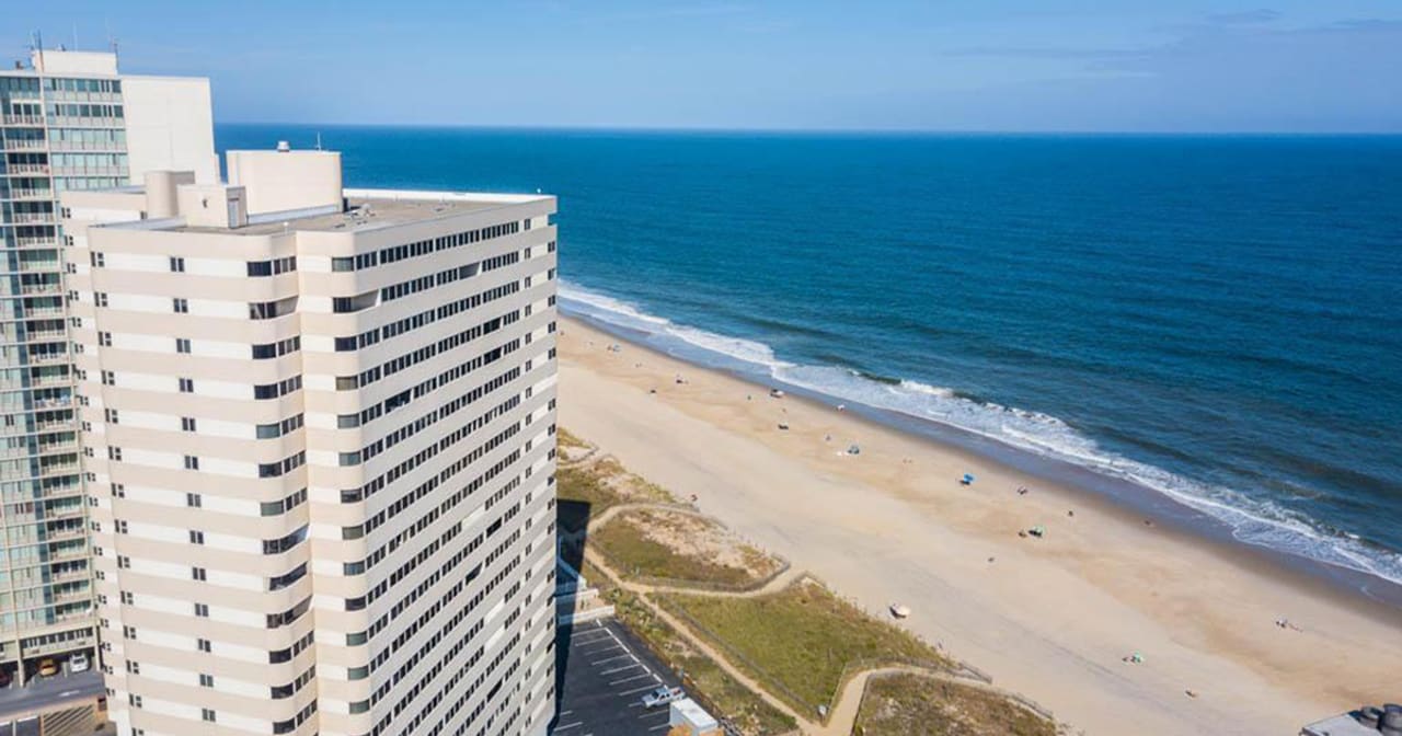 Maryland Waterfront Beach Condos inception-app-prod/NTBmZTc1MmItNWRkZi00MWQzLThkMWMtMWYwNzc2YjIzODhi/content/2021/06/CoastalMDWaterfrontBeachCondosFeature1200x630.jpg