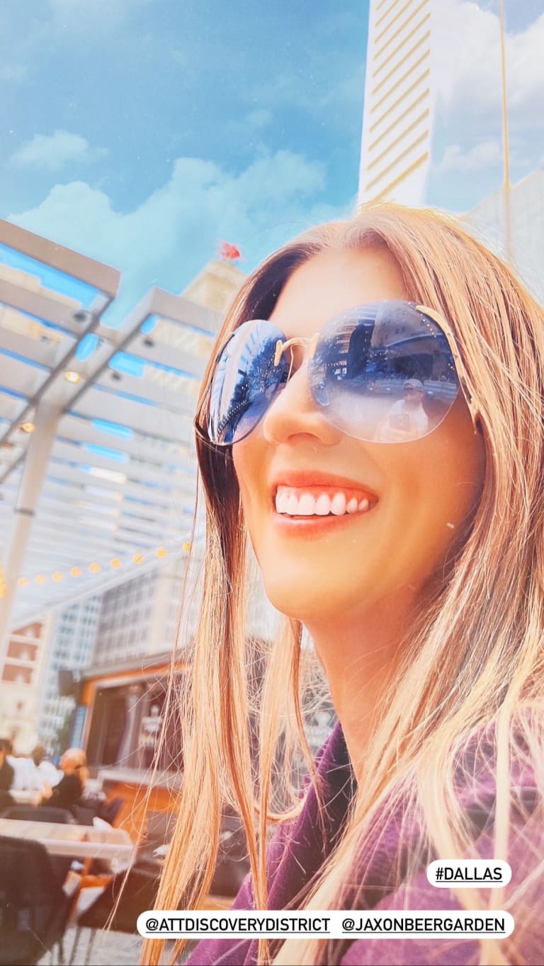 Steavy Carter smiling in reflective blue-lens, gold-framed sunglasses — bold and stylish real estate branding photo.
