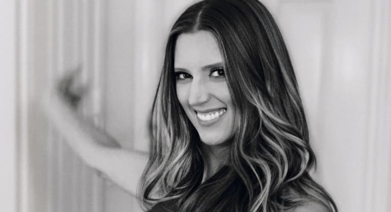 Close-up black and white portrait of Steavy Carter smiling — timeless and elegant branding image.