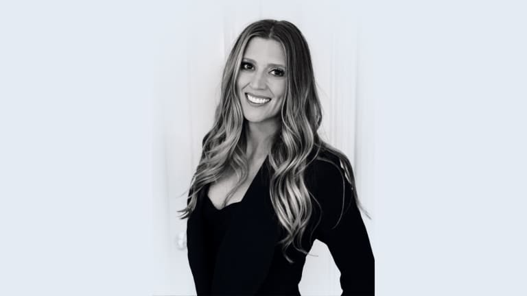 Elegant branding photo of Steavy Carter in a black dress with blonde hair — bold and confident.