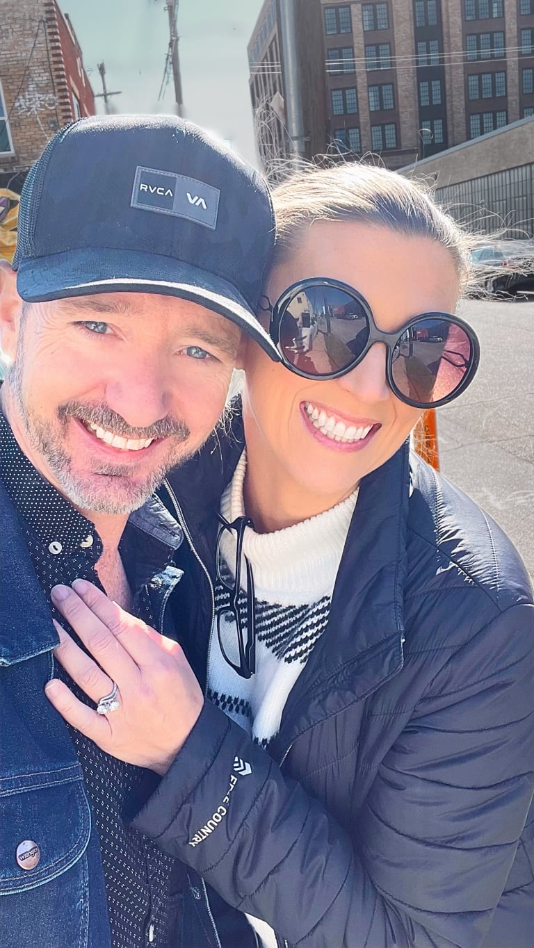 Post-engagement photo of Sean and Steavy Carter, showing off Steavy’s engagement ring — joyful and memorable moment.