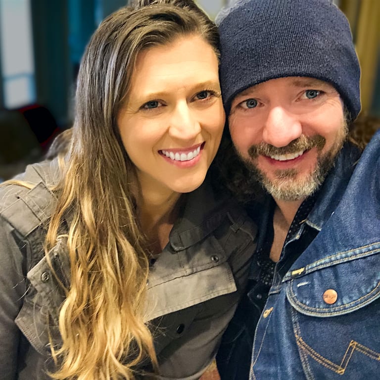 Winter photo of Sean in a beanie and Steavy in a green jacket, laughing together — cozy and fun.