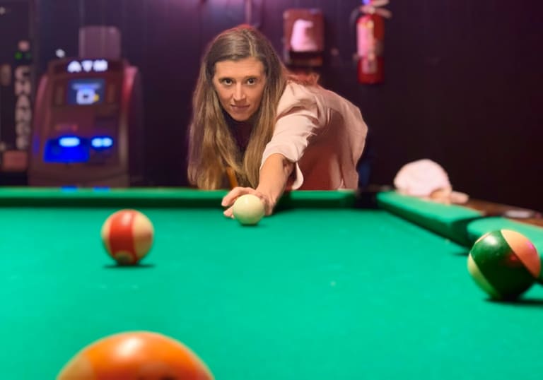 Creative lifestyle photo of Steavy Carter at a pool table — unique and artistic brand moment.