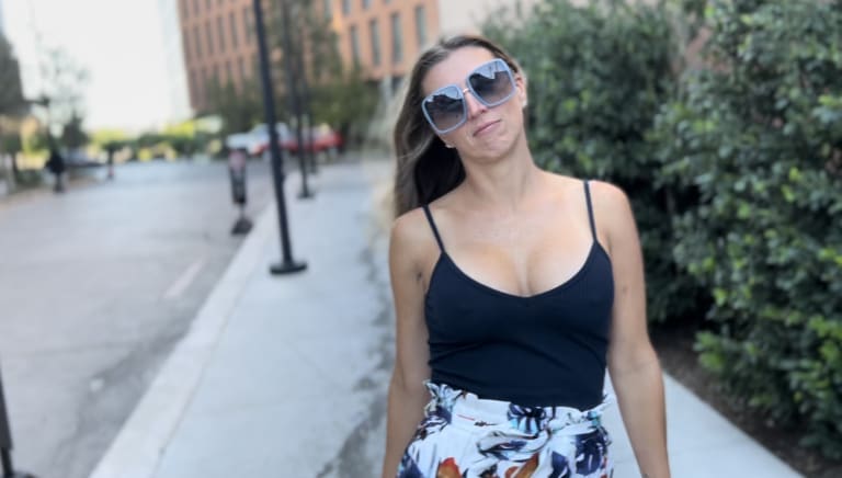 Sassy moment of Steavy Carter making a playful face in the heart of Deep Ellum — real and relatable brand energy.
