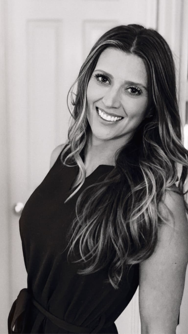 Steavy Carter smiling sweetly in a soft black and white headshot — approachable and heartfelt expression.