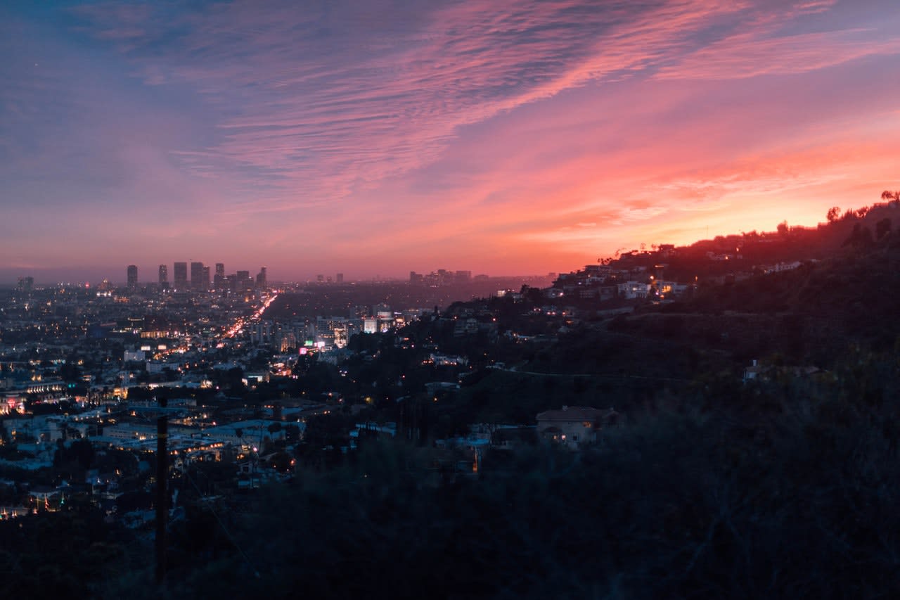 sunsets over the hills of Los Angeles with DTLA in background