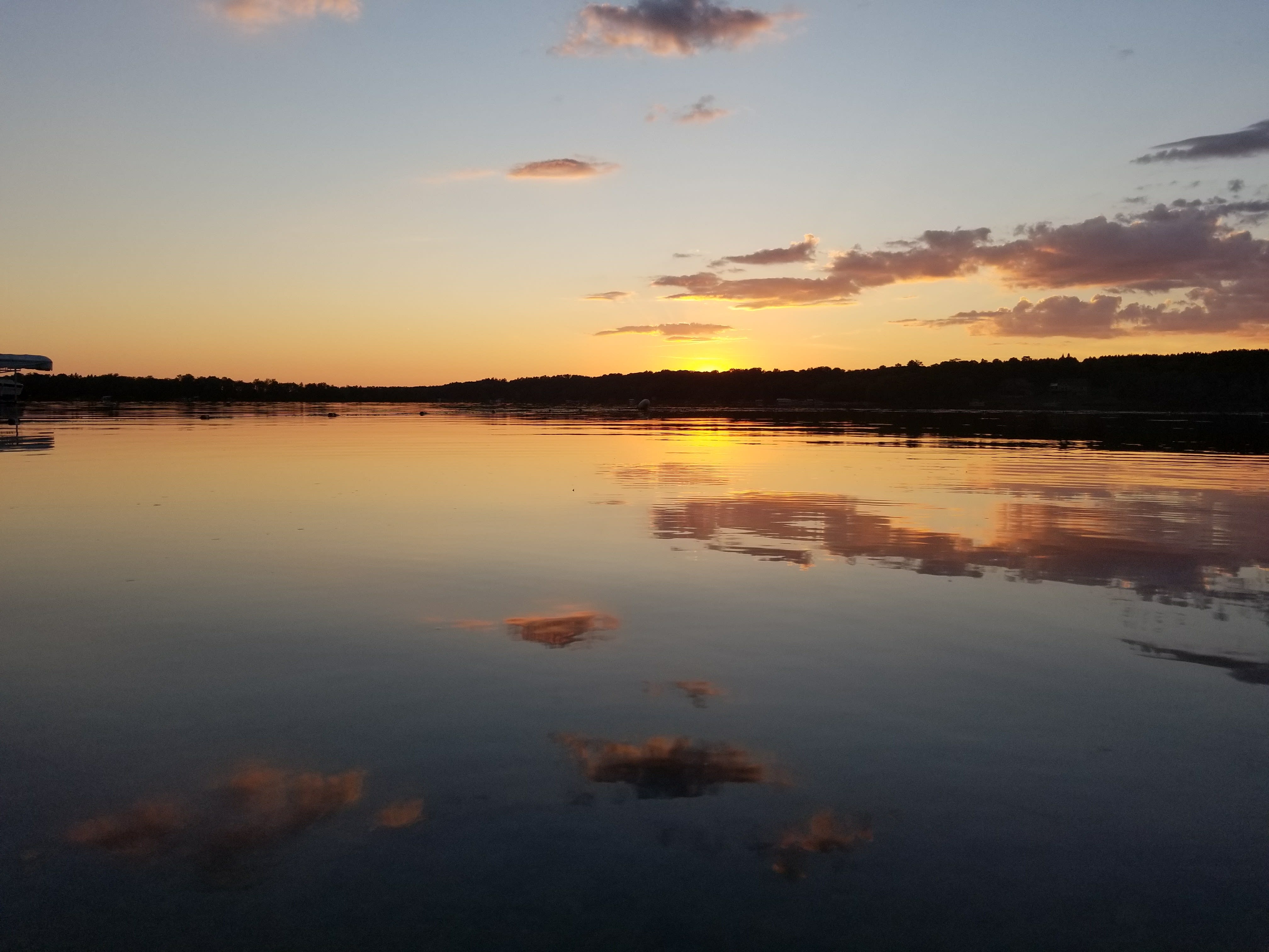Mirrored sunset across Ossawinnamakee Lake