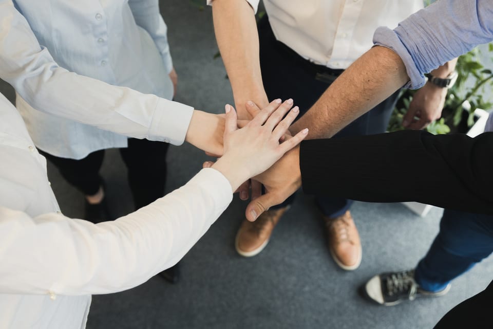 Who's Invited to the Party? A Who's Who of the Homebuying Process inception-app-prod/NTBlYzFmYWYtYzA5Yi00ZTFiLWI0MzMtMzQ1ZGNlYWQyMzBm/content/2018/02/Pan Florida Realty_Who%27s Invited to the Party_Group hands-2.jpg