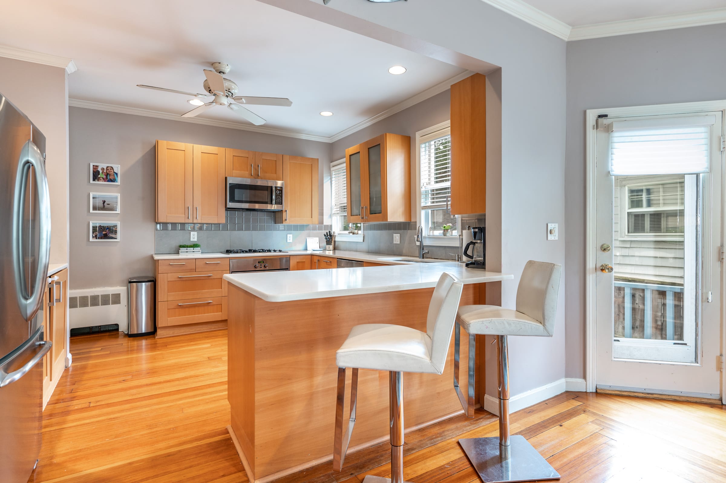 SOLD! 150 Walnut Street Unit 1 in Brookline kitchen, door to private patio/garden
