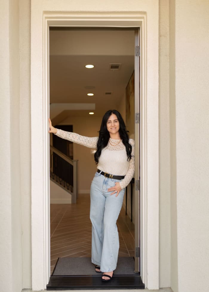 Megan Branson, Solano County REALTOR, welcoming buyers at the front door of a listing