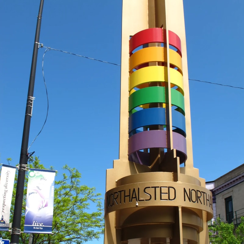 Gold pylon with rainbow rings and the Northalsted name on N Halsted St in Chicago's Lakeview neighborhood
