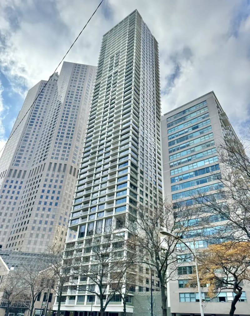 Tall modern residential tower with recessed balconies at Lake Shore Drive and Oak Street in the Gold Coast, Chicago