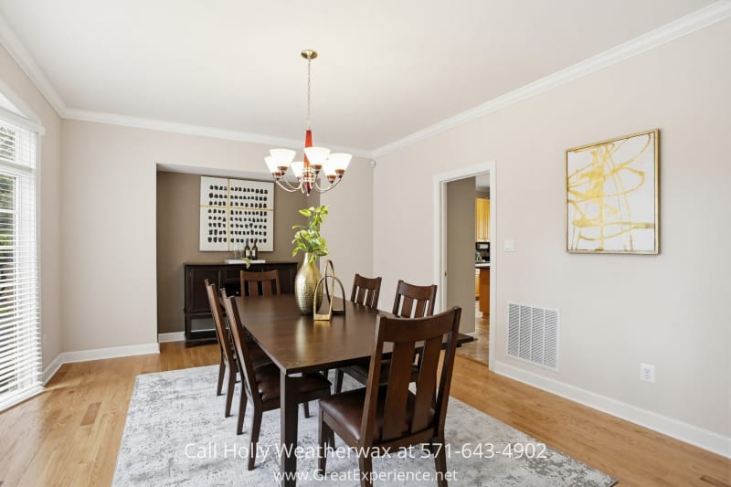 11316 Bright Pond Lane 22 Elegant dining room at 11316 Bright Pond Lane, Reston, VA featuring hardwood floors, large windows, and a spacious layout ideal for gatherings and entertaining.