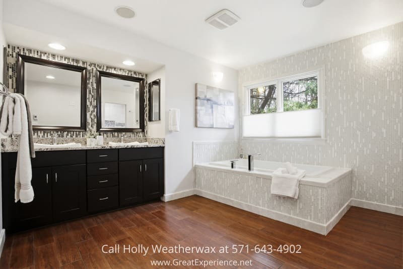 11316 Bright Pond Lane 20 Spa-like primary bathroom at 11316 Bright Pond Lane, Reston, VA featuring a soaking tub, double vanity, and modern finishes with natural light.