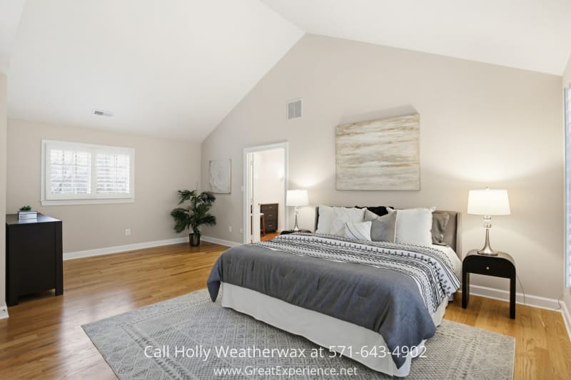 11316 Bright Pond Lane 8 Spacious primary bedroom at 11316 Bright Pond Lane, Reston, VA featuring vaulted ceilings, hardwood floors, and a serene, light-filled layout.